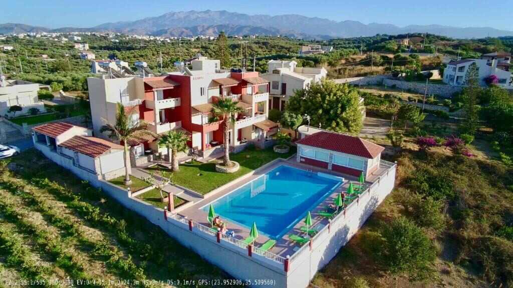 Aerial view of Eliros Studios and its pool in Stalos, Crete